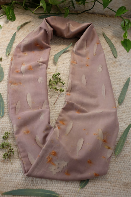 ecoprinted infinity scarf, in a grey purple tone with prints of olive leaves and cosmos flower speckles.