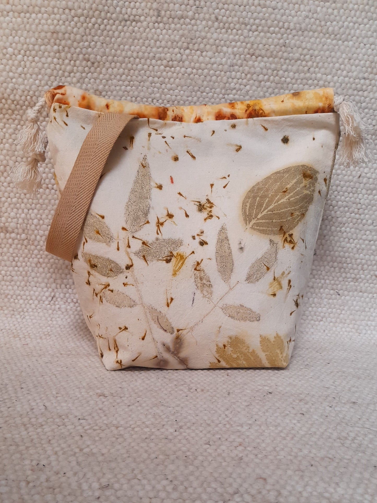 ecoprinted project bag , leaves in a white background