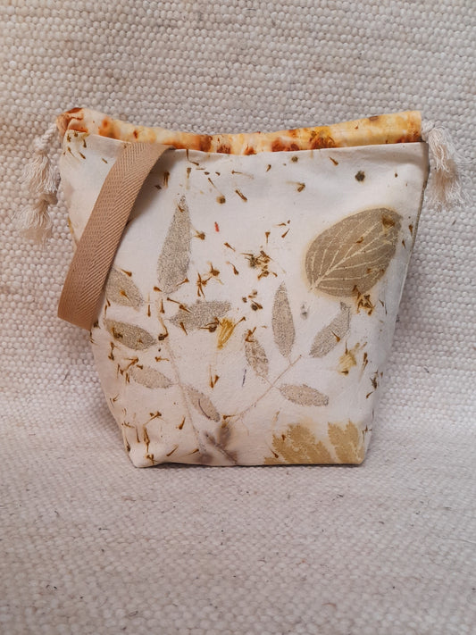 ecoprinted project bag , leaves in a white background